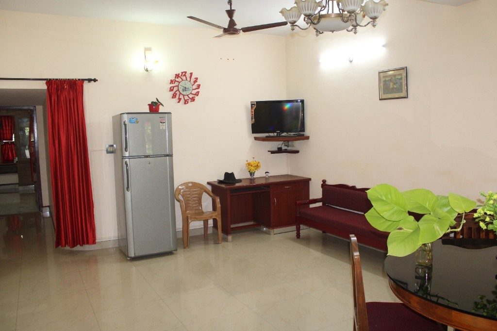 Comfortable living and dining area at The Colonel's Homestay